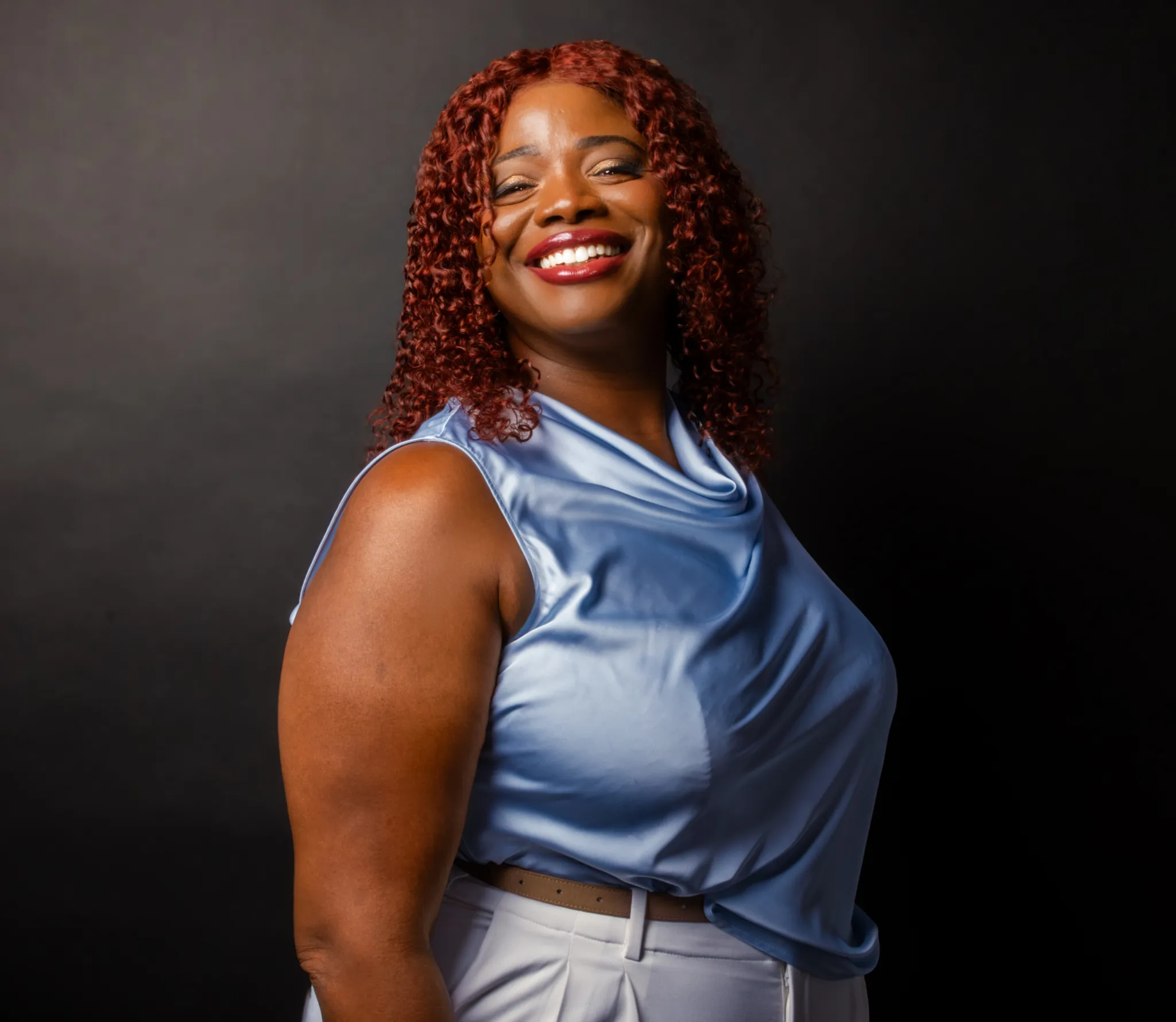Latoya Reid, founder of ReiSpace, smiling.